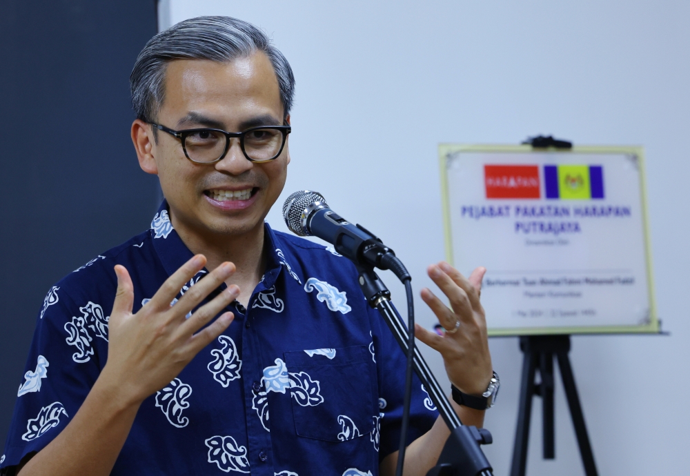 Communications Minister Fahmi Fadzil speaks to reporters after inaugurating the Pakatan Harapan (PH) office in Putrajaya May 1, 2024. ― Bernama pic