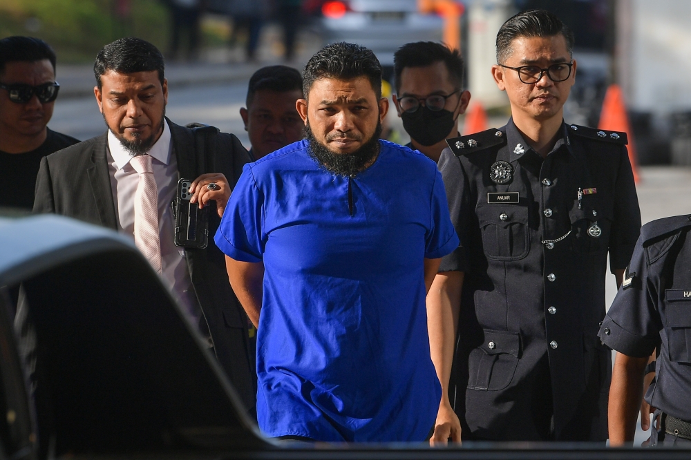 Blogger Wan Muhammad Azri Wan Deris, or Papagomo pleaded not guilty to the charge before Judge Siti Aminah Ghazali. ― Bernama pic