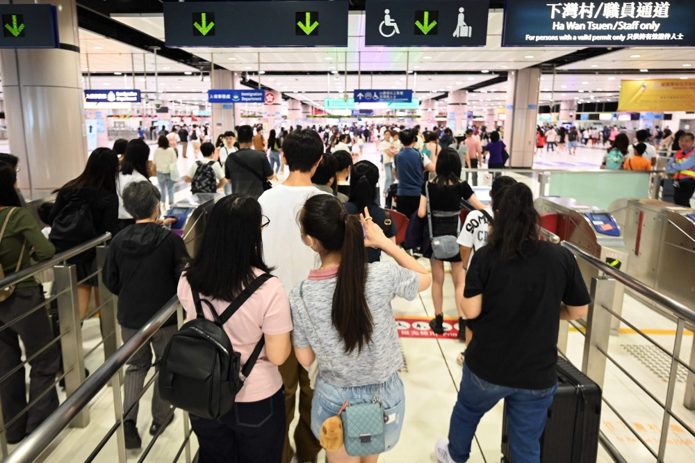 The Lo Wu arrival hall on Hong Kong’s border used to throng with visitors during mainland China’s Golden Week, but as the five-day tourism bonanza kicked off on Wednesday, the queues there were modest. — AFP pic