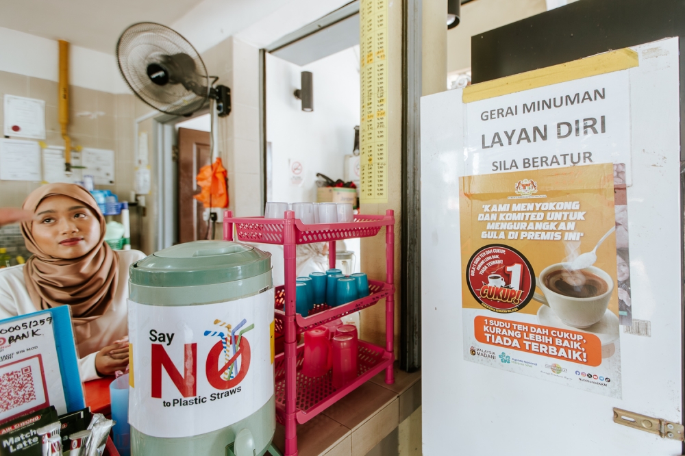 Despite efforts such as the Kurang Manis pilot programme in Putrajaya, which encourages vendors to serve drinks with reduced sugar content, the response from the public has been lukewarm, with many residents unaware of the initiative. — Picture by Raymond Manuel