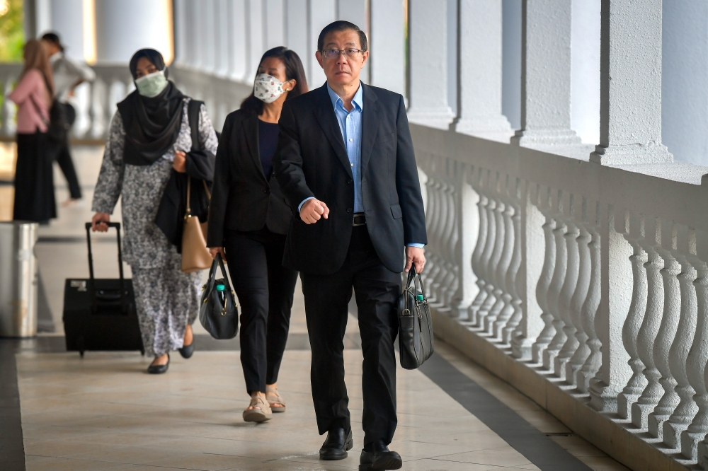 The Penang High Court has ruled that the corruption trial of former chief minister Lim Guan Eng, his wife Betty Chew, and businesswoman Phang Li Koon will continue. — Bernama pic