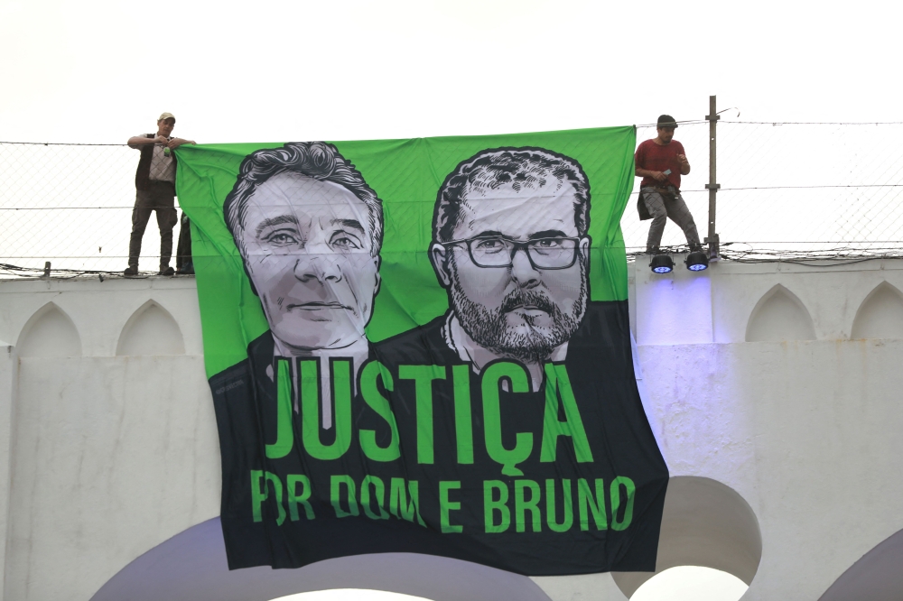 A demonstration in Rio de Janeiro, Brazil on June 26, 2022 to call for justice for the murder Brazilian indigenous expert Bruno Pereira and the British journalist Dom Phillips, who were murdered while on a reporting mission in the Amazon rainforest. Seventy per cent of environmental journalists from 129 countries, polled in March, reported experiencing attacks, threats or pressure related to their job, Unesco said yesterday. — AFP pic