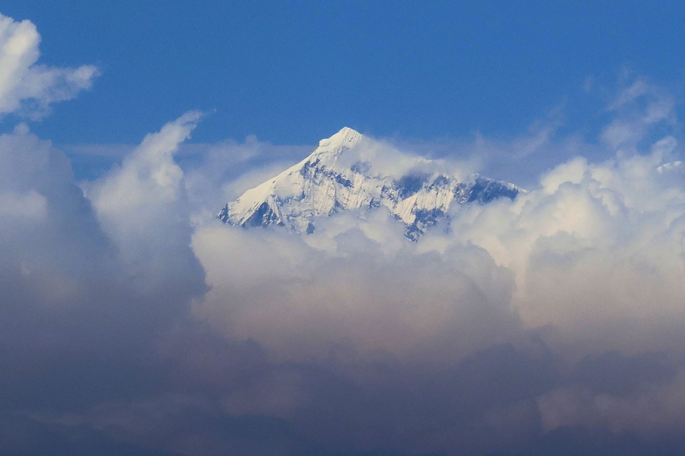 An aerial picture taken on March 7, 2023, midair from a helicopter shows the summit of Mount Everest, the highest mountain in the world at 8,849 metres, in Nepal's Himalayan range. — AFP pic