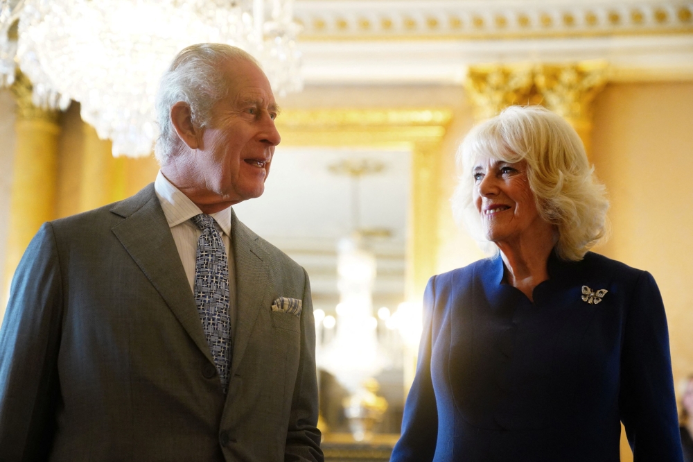 Britain's King Charles and Queen Camilla after being presented with the Coronation Roll, an official record of their Coronation, at Buckingham Palace, central London, Britain May 1, 2024. ― Victoria Jones/Pool via Reuters