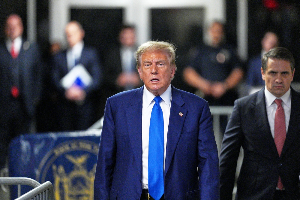 Former US president Donald Trump arrives to speak to the press at the New York State Supreme Court in New York May 3, 2024. ― AFP pic