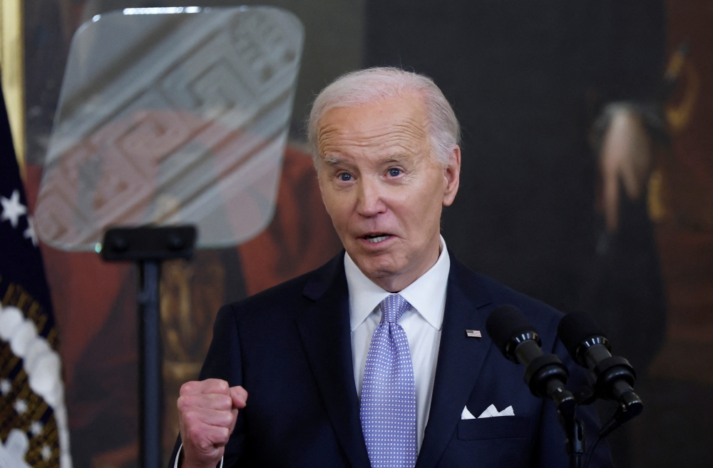 The White House says President Joe Biden's administration will allow certain immigrants illegally brought to the US as children access to federally run health insurance. ― Reuters pic