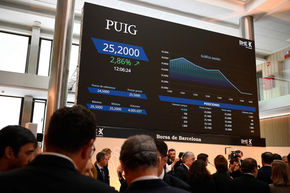 A stock market display shows information about Spanish fashion and beauty group Puig, following the initial public offerings of the company in Barcelona May 3, 2024. — AFP pic 