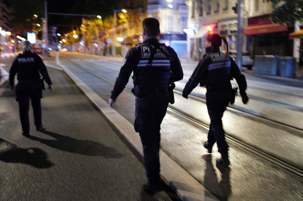 File photo of municipal police forces patrolling a street in Nice on April 2, 2024. ― AFP pic