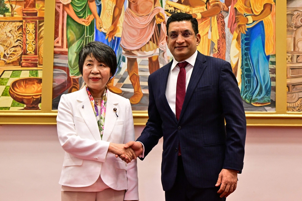 Sri Lanka’s Foreign Minister Ali Sabry (right) shakes hands with Japan’s foreign Minister Yoko Kamikawa after a joint press conference in Colombo on May 4, 2024. ― AFP pic