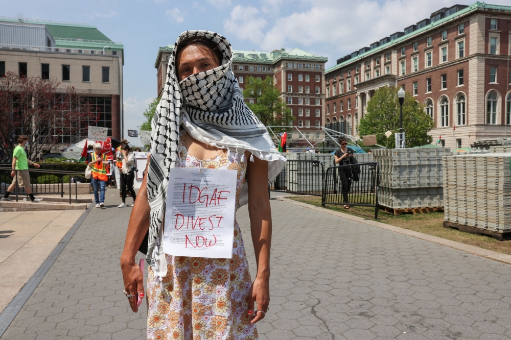 File photo of a student standing for a portrait wearing their response to a deadline issued by Colombia University officials, in front of a protest encampment on campus maintained in support of Palestinians, despite a 2pm deadline issued by university officials to disband or face suspension, during the ongoing conflict between Israel and the Palestinian Islamist group Hamas, in New York City, US, April 29, 2024. ― Reuters pic