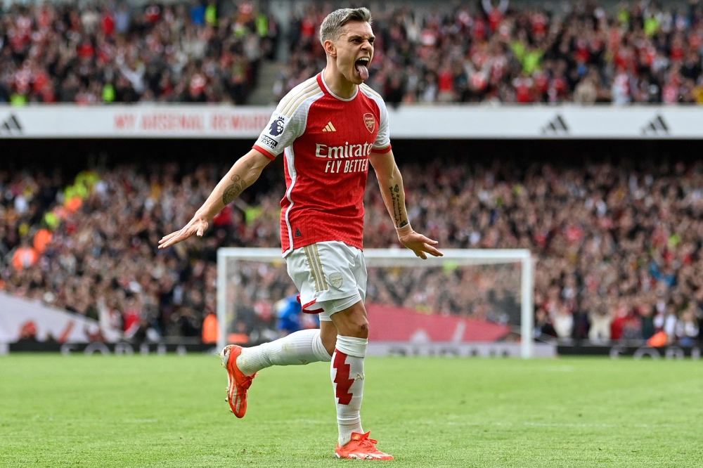 Arsenal’s Belgian midfielder #19 Leandro Trossard celebrates scoring the team’s second goal during the English Premier League football match between Arsenal and Bournemouth at the Emirates Stadium, in London, on May 4, 2024. ― AFP pic
