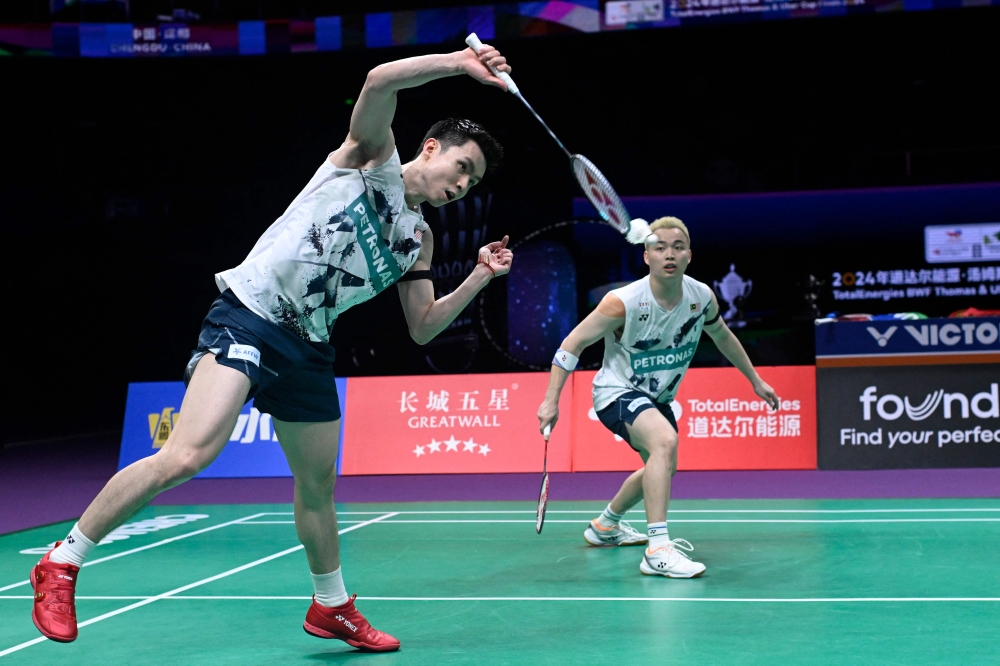 Malaysia’s Aaron Chia (right) and Soh Wooi Yik play a point against China’s Liang Wei Keng and Wang Chang during their men’s doubles semi-final match at the Thomas and Uber Cup badminton tournament in Chengdu May 4, 2024. — AFP pic