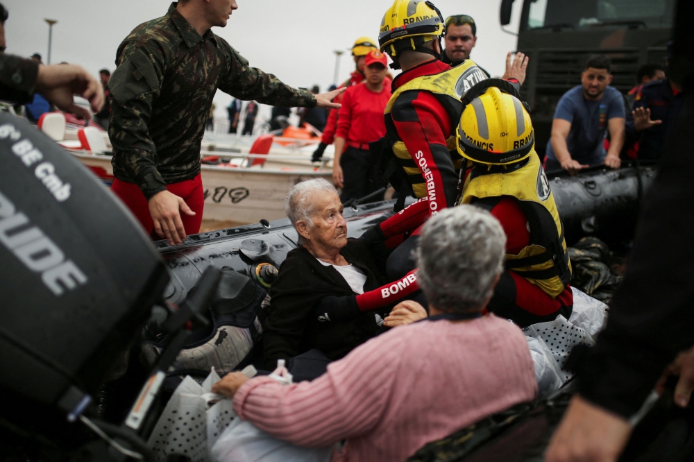 Elderly women are rescued from the floods in Porto Alegre, in Rio Grande do Sul, Brazil, May 4, 2024. ― Reuter pic