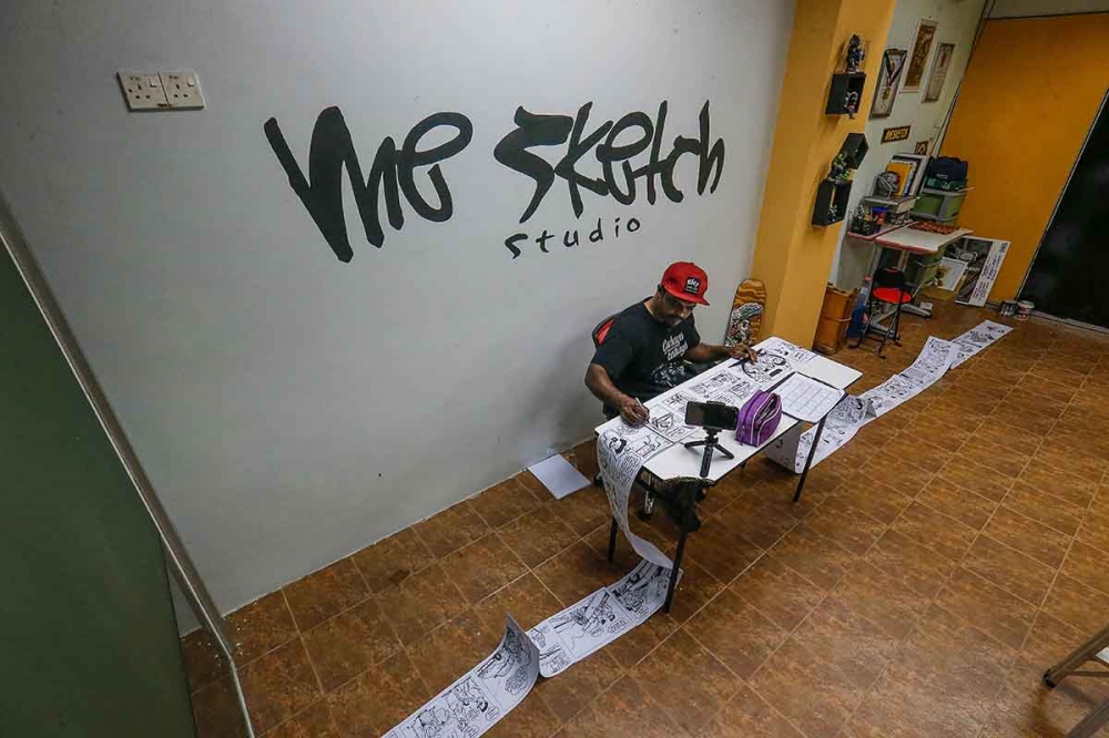 Azmi Hussin illustrated a record-breaking 150-metre long comic strip three years ago titled ‘Saga Kami’ that tells the story of different cultures, customs and practices of three different Malaysian families that evolved around a Proton Saga car. — Picture by Sayuti Zainudin