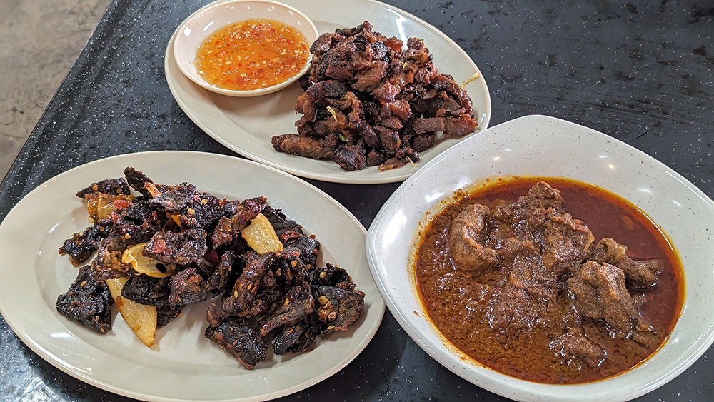 Clockwise from the top: 'daging bakar', 'gulai daging kawah' and 'paru sambal'.