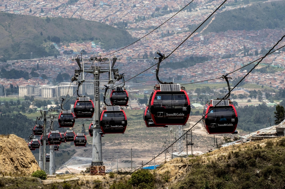 TransMiCable cable car carriages pass above Ciudad Bolivar neighbourhood in Bogota April 14, 2024. — AFP pic