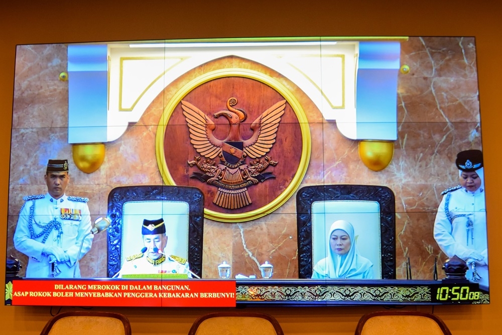 Wan Junaidi delivers his opening address. Seated beside him is his wife Toh Puan Fauziah Mohd Sanusi. — The Borneo Post pic
