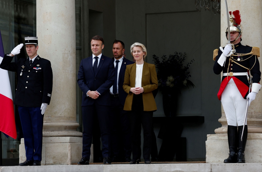 French President Emmanuel Macron and European Commission President Ursula von der Leyen accompany China's President Xi Jinping (not seen) as he leaves after a trilateral meeting at the Elysee Palace in Paris as part of the Chinese president's two-day state visit in France, May 6, 2024. — Reuters pic