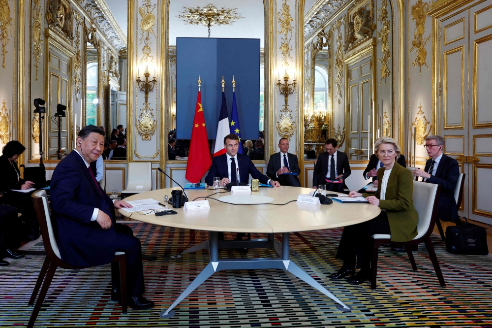 (From left) Chinese President Xi Jinping, France's President Emmanuel Macron, and European Commission President Ursula von der Leyen hold a trilateral meeting as part of the Chinese president's two-day state visit, at the Elysee Palace in Paris May 6, 2024. — Gonzalo Fuentes/Pool/AFP pic 