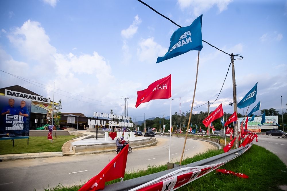 Party flags in Kuala Kubu Baru, May 5, 2024. PN’s all-Malay banner can be seen in the background. An analyst said the lack of multilingual campaign material indicated that PN has not yet begun to look past Malay support. — Picture by Raymond Manuel