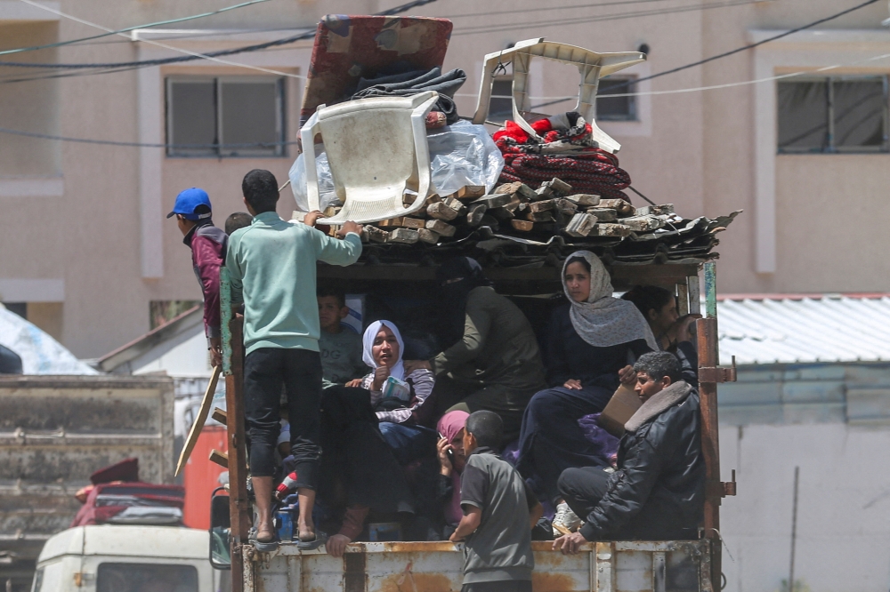 People flee the eastern parts of Rafah after the Israeli military began evacuating Palestinian civilians ahead of a threatened assault on the southern Gazan city, amid the ongoing conflict between Israel and Hamas, in Rafah, in the southern Gaza Strip May 6, 2024.  — Reuters pic