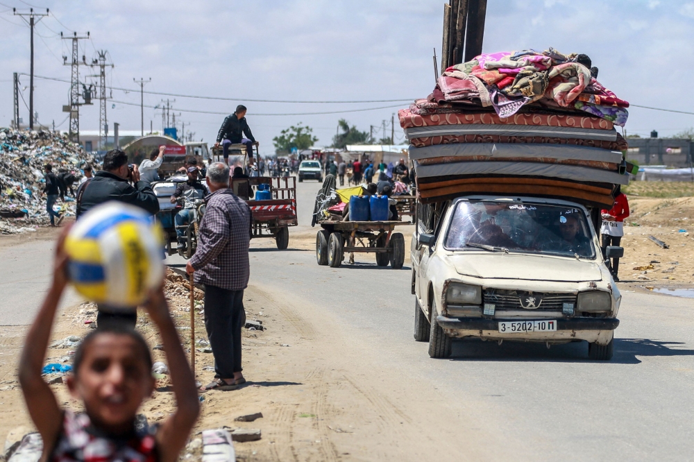 Displaced Palestinians who left with their belongings from Rafah in the southern Gaza Strip following an evacuation order by the Israeli army, arrive to Khan Yunis on May 6, 2024, amid the ongoing conflict between Israel and the Palestinian Hamas movement. — AFP pic