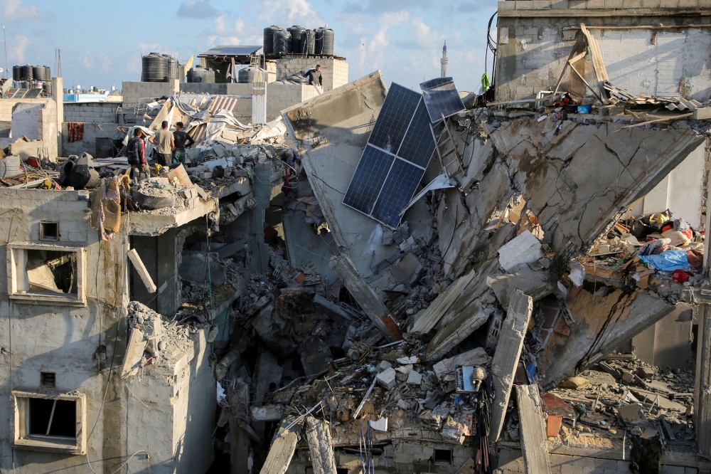 Palestinians inspect the site of an Israeli strike on a house, amid the ongoing conflict between Israel and the Palestinian Islamist group Hamas, in Rafah, in the southern Gaza Strip May 7, 2024. — Reuters pic