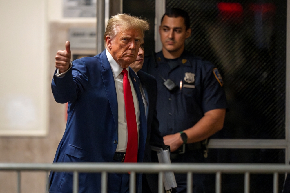 Republican presidential candidate and former U.S. President Donald Trump walks, as his criminal trial over charges that he falsified business records to conceal money paid to silence porn star Stormy Daniels in 2016 continues, at Manhattan state court in New York City May 6, 2024.  — Reuters pool pic