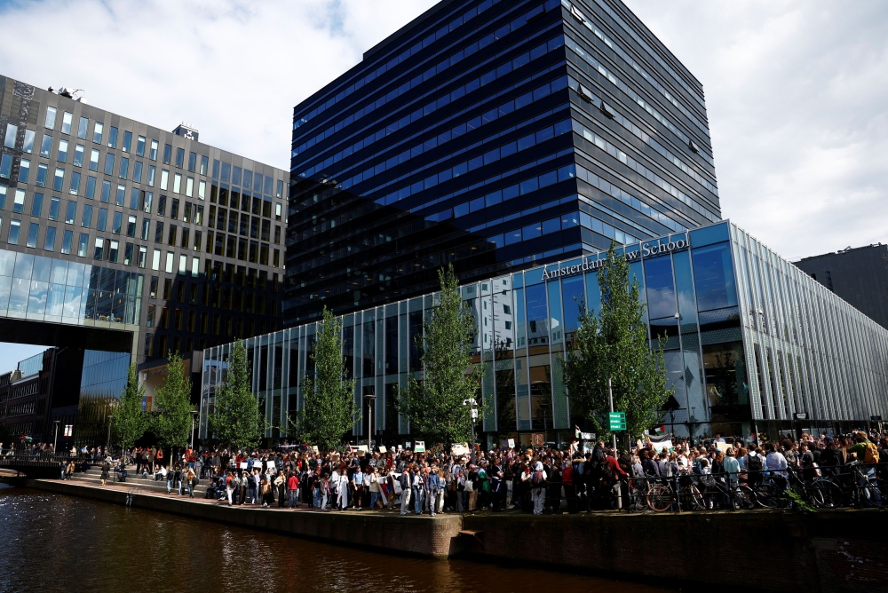 Students and employees of the University of Amsterdam protest against the ongoing conflict between Israel and the Palestinian Islamist group Hamas in Gaza and the University leadership after police broke up a student protest camp in Amsterdam overnight, in Amsterdam, Netherlands, May 7, 2024. — Reuters pic