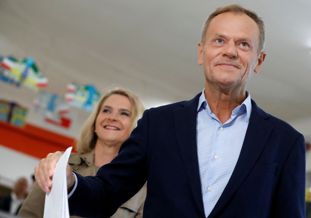 Polish Prime Minister Donald Tusk (seen here with wife Malgorzata Tusk) called a meeting of the Secret Services Council for tomorrow to discuss 'alleged Russian and Belarusian influence in the Polish power apparatus in previous years'. — Reuters file pic