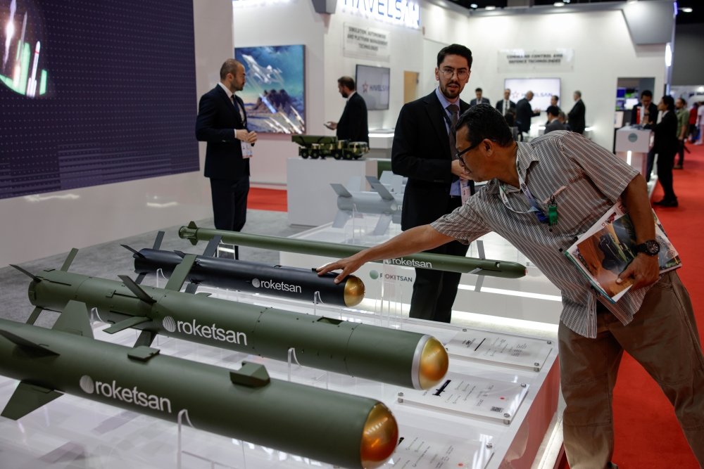 A trade visitor examines Turkish defence manufacturer Rocketsan’s projectiles at Defence Services Asia (DSA) and National Security (NatSec) Asia 2024 at the Malaysia International Trade and Exhibition Centre (Mitec), including the Karaok (missile in black), a portable short-range anti-tank guided missile system recently acquired by Malaysia. — Bernama pic 
