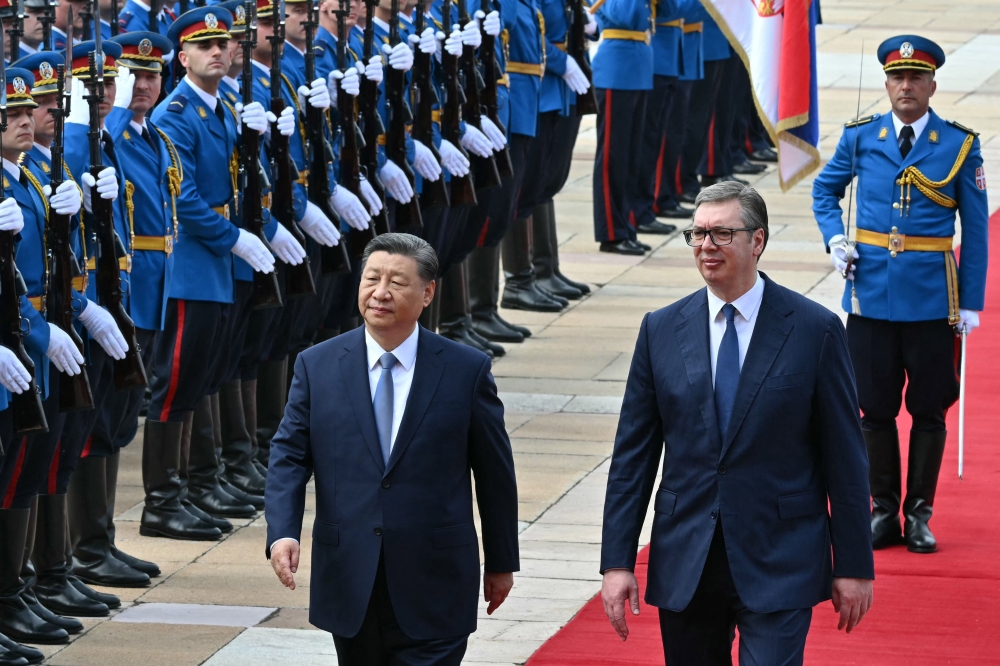 Serbian President Aleksandar Vucic (R) walks with Chinese President Xi Jinping during a welcome ceremony in Belgrade, on May 8, 2024. Chinese President Xi Jinping will hold talks with his Serbian counterpart in Belgrade on May 8, 2024, as Beijing seeks to deepen its political and economic ties with friendlier countries in Europe. — AFP pic