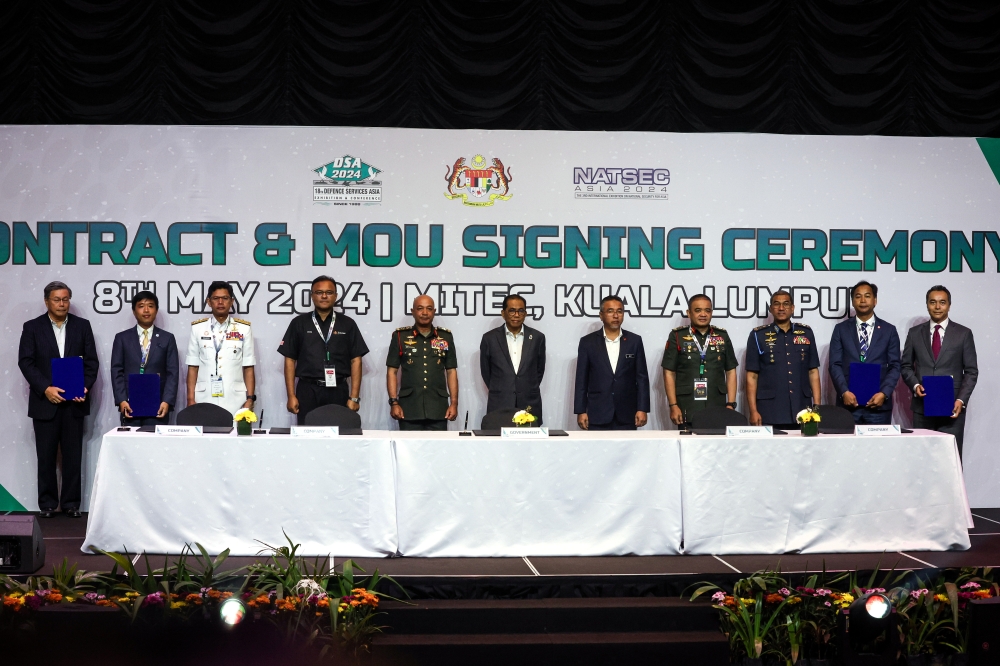 Defence Minister Datuk Seri Mohamed Khaled Nordin witnesses the signing ceremony on the sidelines of the Defence Services Asia (DSA) and National Security (NatSec) Asia 2024 exhibition, May 8, 2024. — Bernama 