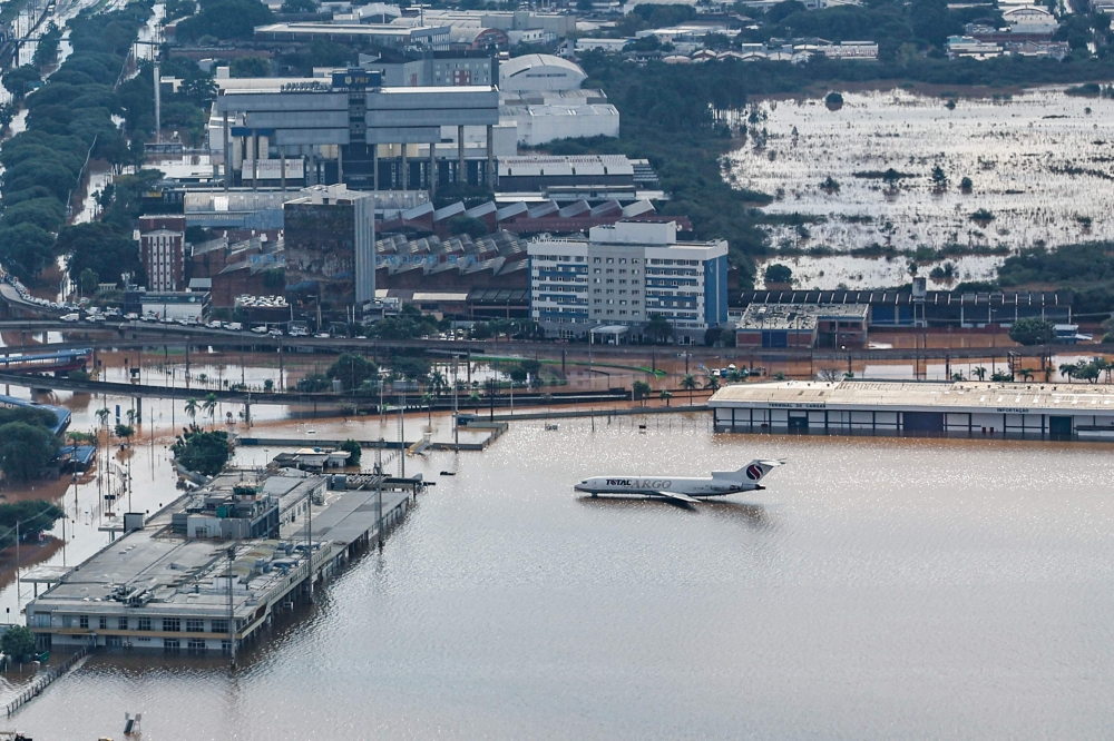 An aerial view of a plane in the flooded airport of Porto Alegre. — AFP pic/Brazilian Presidency/Ricardo Stuckert 