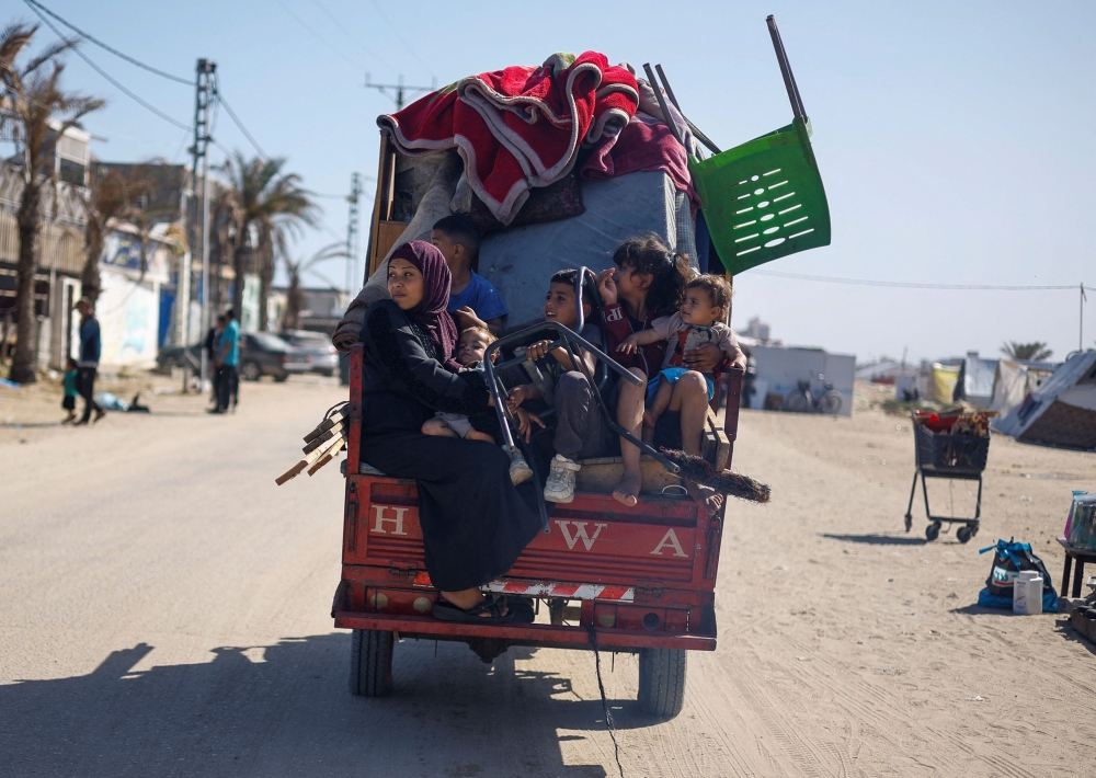 Palestinians travel in a vehicle as they flee Rafah after Israeli forces launched a ground and air operation in the eastern part of the southern Gaza city, amid the ongoing conflict between Israel and Hamas, in the southern Gaza Strip May 9, 2024. — Reuters pic