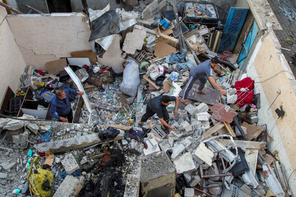 Palestinians inspect a house damaged in an Israeli strike, amid the ongoing conflict between Israel and the Palestinian Islamist group Hamas, in Rafah, in the southern Gaza Strip May 9, 2024. — Reuters pic