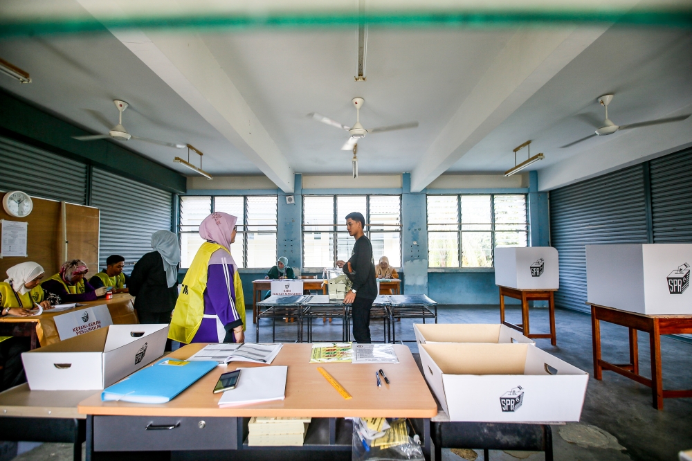 Eighteen polling centres with 74 voting streams for the by-election opened simultaneously at 8am. ― Picture by Hari Anggara