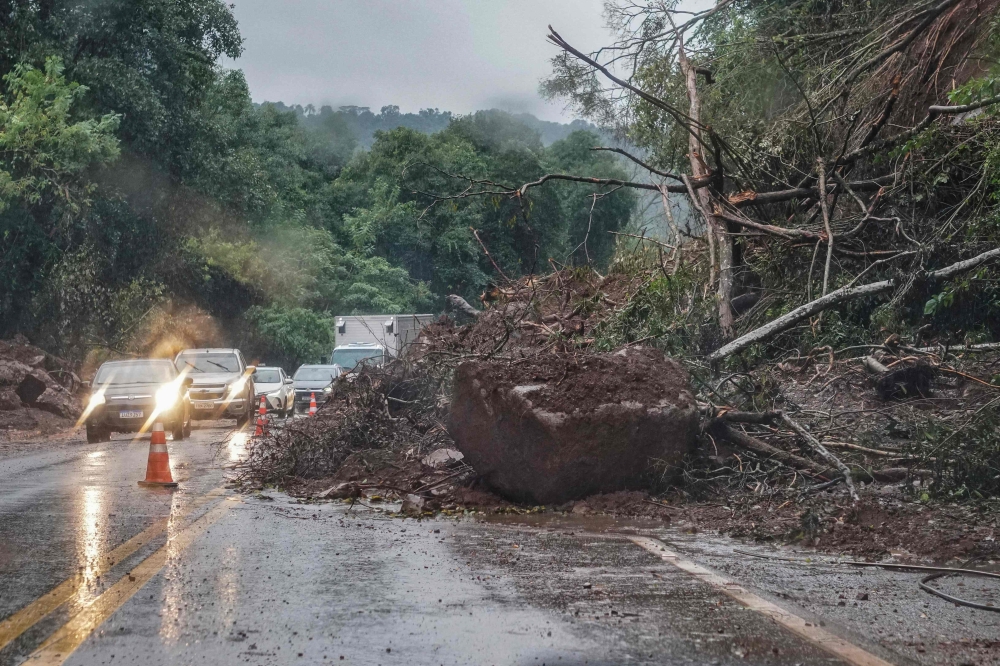 View of the partially blocked RS 129 road after flooding caused by heavy rains in Encantado, Rio Grande do Sul state, Brazil May 10, 2024. — AFP pic