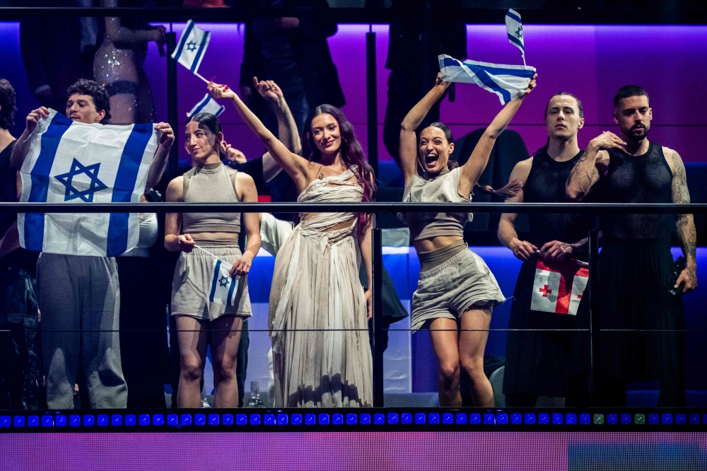 Singer Eden Golan (centre) representing Israel with the song ‘Hurricane’ celebrates after placing in the final after the second semi-final of the 68th edition of the Eurovision Song Contest at the Malmo Arena, in Malmo, on May 9, 2024. — AFP pic