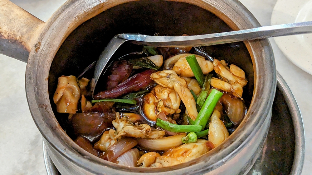 Claypot frog with spring onion is one of the popular preparations for fresh frogs to go with your porridge at Restoran Three Pot. – Pictures by Ethan Lau