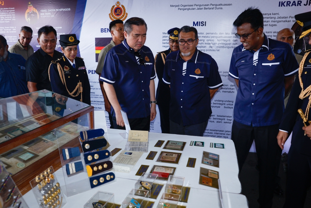 Transport Minister Anthony Loke looks at the exhibition at the 78th JPJ Day Anniversary Celebration at the Malaysian Road Transport Academy in Melaka at Ayer Molek May 11, 2024. — Bernama pic