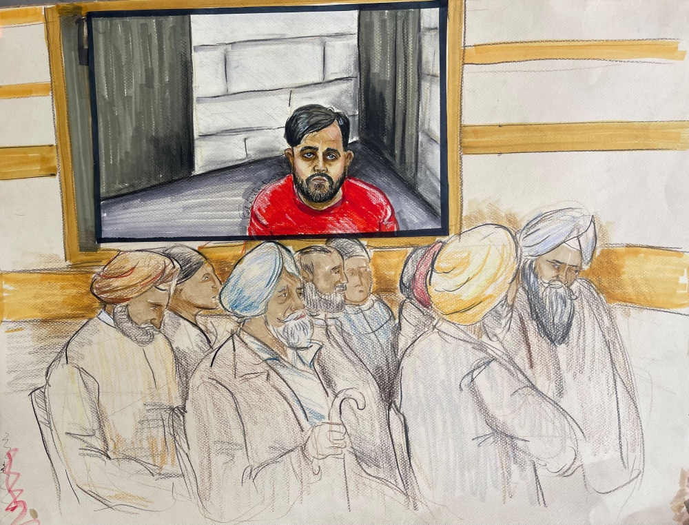 Karan Brar, one of the three individuals charged with first-degree murder and conspiracy to commit murder in relation to the murder in Canada of Sikh separatist leader Hardeep Singh Nijjar in 2023, appears by video link as members of the Sikh community attend in Surrey Provincial Court in Surrey, British Columbia, Canada May 7, 2024 in a courtroom sketch. — Reuters pic