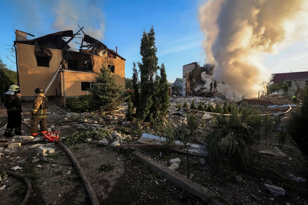 Firefighters work at a site of a Russian missile strike, amid Russia's attack on Ukraine, in Kharkiv, Ukraine May 10, 2024. — Reuters pic
