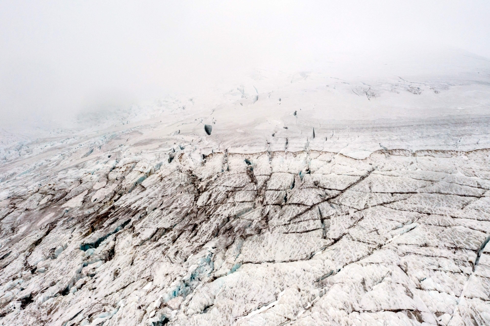 Aerial view of the Ritacuba Blanco glacier at El Cocuy National Natural park in Boyaca province, Colombia April 19, 2024. The Ritacuba Blanco glacier, one of Colombia’s highest snow-capped peaks, should be covered by a blanket of homogeneous snow. But a brutal El NiNo phenomenon melted it and exposed gigantic crevasses, a sign of its agony. — AFP pic
