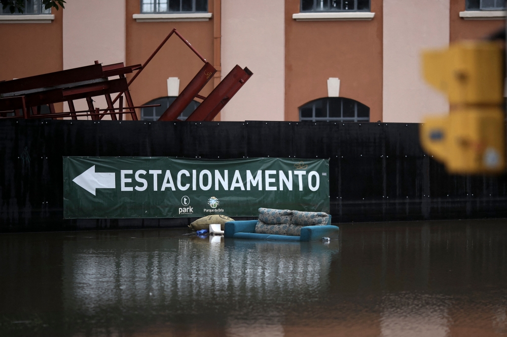 River levels rose again yesterday as strong rains lashed waterlogged southern Brazil, where flooding has killed more than 140 people and forced hundreds of thousands from their homes. — AFP pic