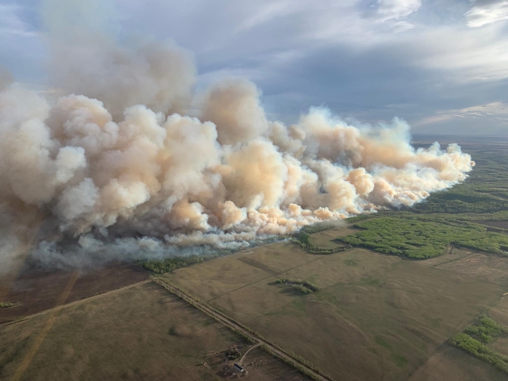 Thousands of people fled their homes yesterday in western Canada as hundreds of wildfires beginning earlier than usual portend a difficult fire season. — AFP pic/Alberta Wildfire Service handout