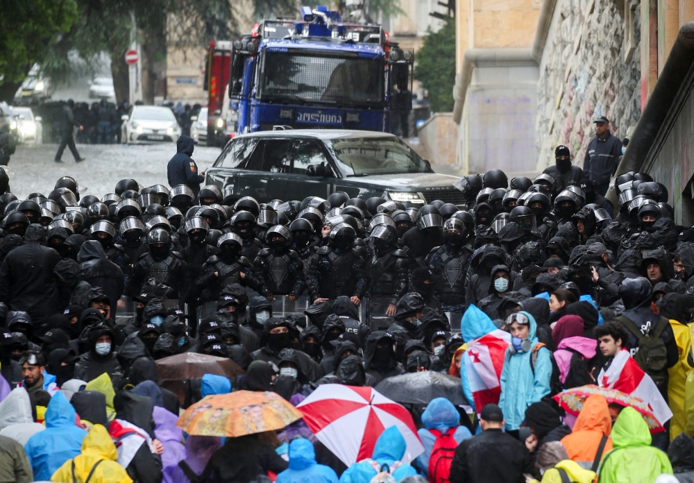 Georgia’s police have begun pushing away demonstrators who staged an all-night rally at parliament in Tbilisi ahead of a lawmakers’ debate of a foreign agents bill that has sparked a political crisis. — Reuters pic