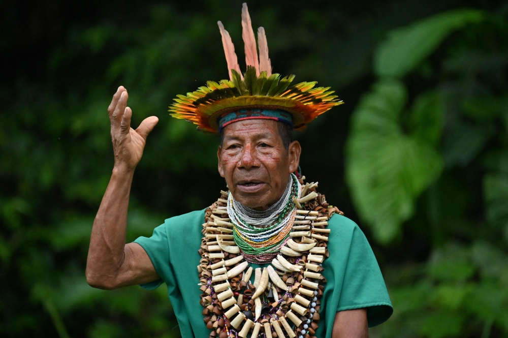 Delio Payaguaje, a Shaman from the Siona indigenous community, talks during an interview with AFP in the protected Amazon rainforest of Cuyabeno, Ecuador March 29, 2024. — AFP pic