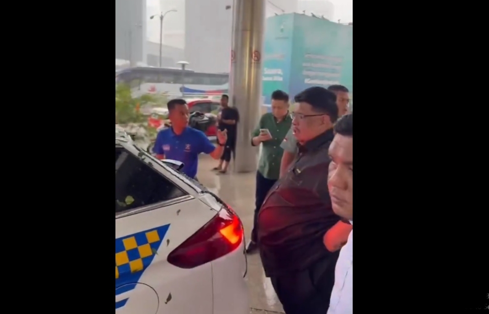 Melaka Chief Minister Datuk Seri Ab Rauf Yusoh was passing the area in front of Kuwait Bank at about 3.30pm when the incident happened during a downpour. — Screengrab from social media 