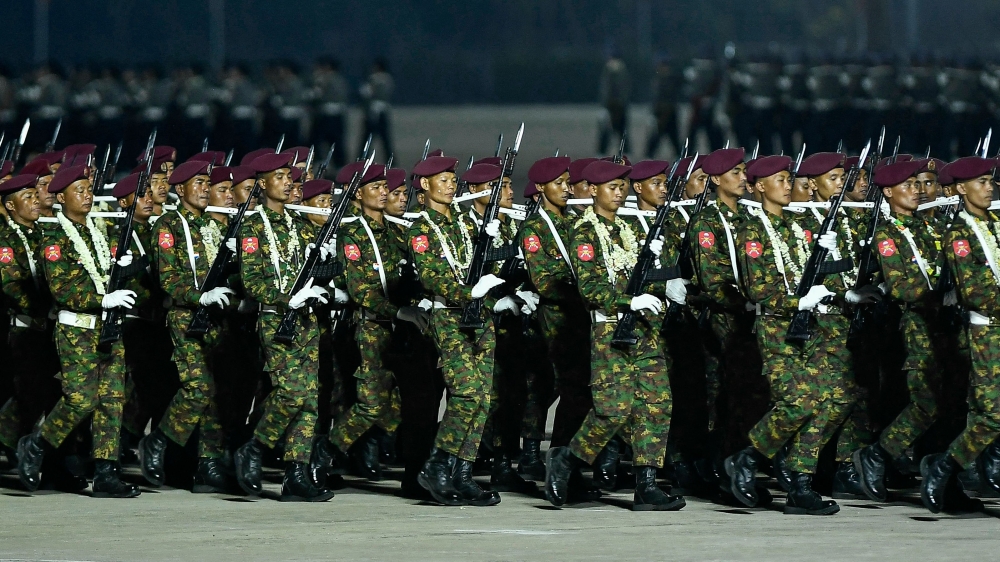 Myanmar junta military soldiers parade during a ceremony to mark the country's Armed Forces Day in Naypyidaw on March 27, 2024. — AFP pic